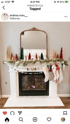 the fireplace is decorated with stockings, stockings and christmas tree garlands on it's mantle