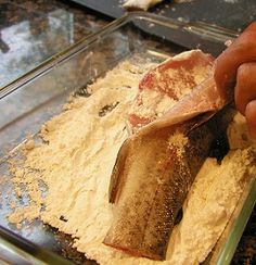 a person is cutting up some food on a counter