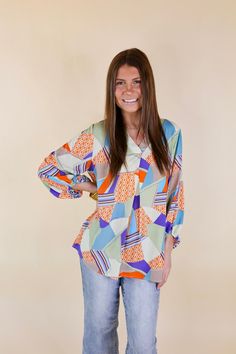 Laying your eyes on this adorable top is like laying your eyes on paradise! It includes a v neckline with a placket, 3/4 sleeves, and a mix print that includes colors of blue, green, and orange. This top is slightly flowy. Pair it with Judy Blue Jeans and sandals for a Spring season look! Arté is wearing a size small. Nicole is wearing a size 1XL. Size Measurements: Small: Bust: 21 inches across the front | Length: 28 inches Medium: Bust: 22 inches across the front | Length: 28.5 inches Large: B Multicolor Split Neck Top For Spring, Blue 3/4 Sleeve Printed Blouse, Vibrant Print V-neck Blouse, V-neck Blouse With Vibrant Print, Vibrant Print V-neck Patterned Blouse, Blue Printed Blouse With 3/4 Sleeves, Blue Printed Split Neck Tops, Patterned Printed Blouse With 3/4 Sleeves, Blue Vibrant Print V-neck Top