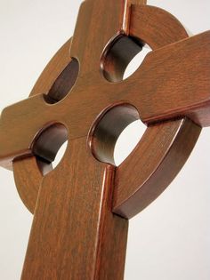 a wooden chair with two holes in the back and one hole at the top that has been cut open