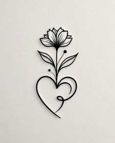 a metal heart with flowers on it