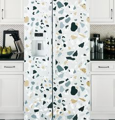 a white refrigerator freezer sitting inside of a kitchen