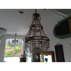 a chandelier hanging from the ceiling in a room