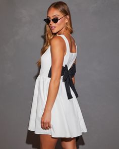 Scoop neckline Fitted waist Back bow detail Side pockets Back zipper closure Lined Shell: 80% Rayon 13% Nylon 7% Spandex, Lining: 80% Polyester 20% Cotton Paris Trip Outfits, Cute Mini Dresses, Bow Mini Dress, Brunch Dress, Paris Trip, Trip Outfits, Festival Shop, Prom Night, Vacation Dresses