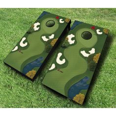 a pair of cornhole game boards on the grass