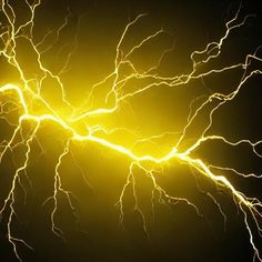 lightning strikes in the night sky with bright yellow lightening from it's electrical discharge