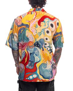 A psychedelic painting shows shape and motion as its pieces bend and morph toward the whole. Multi, Mulberry Crepe Silk Fabric Original Artwork by Alexandra Anderson Limited Edition of 100 Camp Collar Short Sleeves Straight Hem Mother of Pearl Buttons 100% Mulberry Crepe Silk Unisex Made in Bali, Indonesia Multicolor Cotton Hawaiian Shirt With All Over Print, Multicolor Graffiti Print Relaxed Fit Top, Multicolor Graphic Print Beach Shirt, Artistic Summer Tops With Abstract Print, Yellow Printed Festival Tops, Yellow Printed Tops For Festival, Artistic Abstract Print Summer Tops, Multicolor Relaxed Fit Shirt With Graffiti Print, Artistic Printed Summer Tops