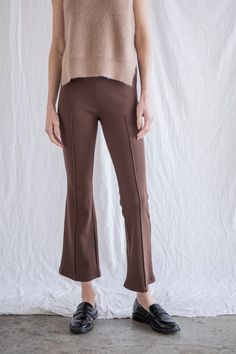 Ribbed stretchy pants with cropped flare fit and elastic waistband. - Sizing: Model is 5'8", wearing a size S - Content: 94% Rayon, 6% Spandex Care: Handwash recommended Imported Stretchy Pants, Dress Home, Black Pants, Spandex, Elastic, Pants, How To Wear, Dresses, Black