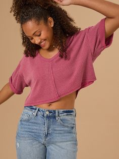 This relaxed ribbed crop top is a must-have for any season. The v-neckline, dolman sleeves, and ribbed detailing are every reason to love this not-so-basic basic top. Trendy V-neck Crop Top For Fall, Ribbed V-neck Top With Relaxed Fit, Trendy Knit V-neck Crop Top, Trendy V-neck Cropped Sweater For Layering, Fall Trendy V-neck Crop Top, Trendy Ribbed Crop Top For Layering, Relaxed Fit Crop Top For Layering, Cropped Knit Tops With Relaxed Fit, Ribbed Knit V-neck Top