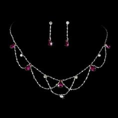 a necklace and earring set with pink stones