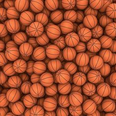 many orange basketballs are piled up together