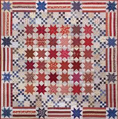 an old quilt with red, white and blue stars on the front is shown in full view