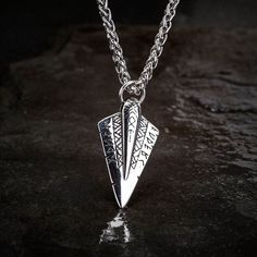 This striking Odin's Spear Necklace is perfect for those who want to make a statement. Made of solid stainless steel, this pendant is in the shape of Gungnir, Odin's spear. The runic decoration adds a touch of mystery, while the sleek, minimalist design makes it versatile enough to wear with any outfit. Supplied with matching 24" / 60cm chain Warrior Style Silver Stainless Steel Jewelry, Viking Style Engraved Stainless Steel Jewelry, Silver Stainless Steel Warrior Jewelry, Viking Style Nickel Free Pendant Necklace, Viking Style Silver Stainless Steel Jewelry, Viking Style Engraved Metal Necklaces, Handmade Viking Style Stainless Steel Jewelry, Spear Necklace, Viking Jewelry Mens Necklace