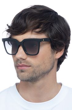 A smooth D-frame silhouette fitted with logo temples brings ultramodern vibes to these sunglasses that provide full-coverage UV protection. 54mm lens width; 22mm bridge width; 148mm temple length 100% UV protection Recycled acrylic Imported Matte Black Polarized Wayfarer Shield Sunglasses, Matte Black Wayfarer Shield Sunglasses With Polarized Lenses, Matte Black Wayfarer Sunglasses With Gradient Lenses, Matte Black Sunglasses With Tinted Square Frame, Matte Black Square Frame Sunglasses With Tinted Lenses, Wayfarer Shield Sunglasses With Tinted Lenses, Modern Shield Sunglasses With Uva Protection And Square Frame, Matte Black Polarized Square Frame Shield Sunglasses, Modern Square Frame Shield Sunglasses With Uva Protection