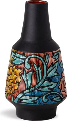 a black vase with colorful designs on it