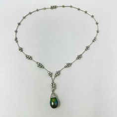 18K Gold Necklace with Detachable Black Tahitian Pearl and 5.68ct Diamonds (includes appraisal, Value: $11,265) Designer = Jewelry Material = 18K Gold Gemstone = Diamond/Pearl Condition = Excellent Class = Premier Location: Glencoe Item Number: 11405-1379 Item ID: 287624 Category: Necklace Luxury Tahitian Pearl Jewelry, Tahitian Pearl Teardrop Jewelry For Formal Occasions, White Gold Necklace, Tahitian Black Pearls, 18k Gold Necklace, White Gold Necklaces, Tahitian Pearls, Designer Jewelry, Item Number