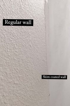 the wall is white and has black text on it that says regular wall skin coated wall