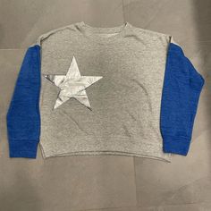 Gray Sweatshirt With Blue Sleeves And A Silver Star Patch. No Tags. Never Worn. Perfect Condition. Label Cut Out. Athletic Heather Long Sleeve Cotton Top, Girls Sweatshirt, Album Art Design, Gray Sweatshirt, Vintage Havana, Girl Sweatshirts, Album Art, Silver Stars, Grey Sweatshirt