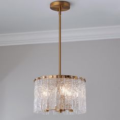 a chandelier hanging from the ceiling in a room