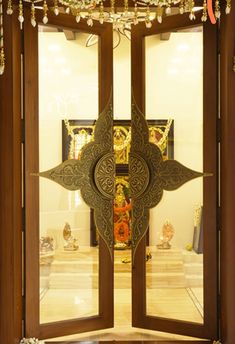 an open wooden door with decorative decorations on it