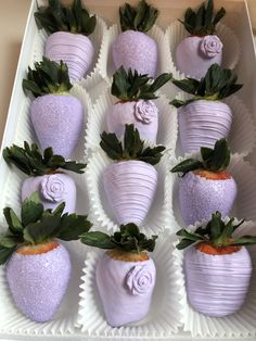 chocolate covered strawberries are arranged in the shape of flowers and leaves on a white tray