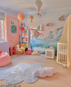 a child's bedroom decorated in pastel colors