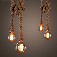 three light bulbs hanging from a rope