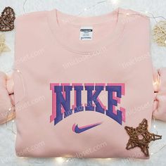 Pink Purple Nike Logo Embroidered Shirt, Nike Inspired Embroidered Hoodie, Best Gifts For Family Welcome to Tinicloset, where we’ve mastered the art of blending style, passion, and individuality into every stitch, and where fashion enthusiasts who adore Nike and the captivating hues of pink and purple find their sartorial haven. We specialize in crafting custom embroidered shirts, sweatshirts, T-shirts, and hoodies, each meticulously designed to elevate your wardrobe and make a statement. Pink Long Sleeve Hoodie With Embroidered Text, Pink Hoodie With Embroidered Text For Winter, Pink Long Sleeve Hoodie With Embroidered Logo, Pink Long Sleeve Hoodie With Custom Embroidery, Trendy Custom Embroidered Winter Sweatshirt, Winter Pink Hoodie With Embroidered Text, Pink Embroidered Hoodie For Winter, Pink Hoodie With Letter Embroidery For Streetwear, Pink Letter Embroidery Hoodie For Streetwear