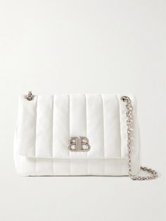 This mini version of Balenciaga’s ‘Monaco’ shoulder bag is padded and quilted to create dimension. It's crafted from sleek white leather and topped with a logo plaque. Despite its petite size, it has enough room to store your phone, wallet and compact and has a discreet pocket in the front flap. Chic White Quilted Bag, White Quilted Bag For Formal Occasions, White Quilted Shoulder Bag For Travel, Luxury White Quilted Shoulder Bag, Elegant White Quilted Bag, White Quilted Evening Bag, White Quilted Shoulder Bag, White Quilted Rectangular Shoulder Bag, White Quilted Crossbody Shoulder Bag