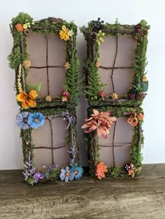 two old window frames are decorated with flowers