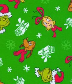 the grinch christmas wrapping paper is green with white snowflakes