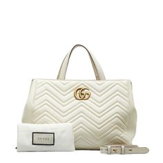 Brand: Gucci Model: GG Marmont Color: White Material: Leather Inclusions: Dust bag, Shoulder strap Dimensions: 24cm x 35cm x 15cm Serial number: 443505 Country of origin: Italy Condition: AB - good condition. The Gucci GG Marmont line offers a stylish handbag and shoulder bag design made from leather in an elegant white hue, featuring a convenient magnet closure, and is designed primarily for women. The bag is in good condition on the exterior, with some signs of use visible on the leather, incl Medium Handbags, Gucci Model, Gucci Models, Bag Design, White Material