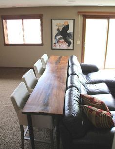 a couch and table in a room with a quote about what to do when you want to