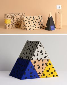 three different boxes with designs on them and one is made out of colored cardboards