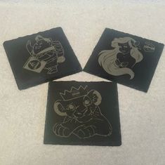 three coasters with disney characters drawn on them