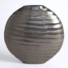 The Chased Oval Vase is made of chiseled aluminum with a black nickel finish. Dimensions Overall 15.5"L x 4.5"W x 15.25"H (7.3 lbs)  Black Nickel Clean with soft dry cloth Product is Watertight Oval Vase, Vase Collection, Brass Antique, Table Vase, Global Views, Aluminum Table, Table Vases, Old Furniture, Furniture Removal