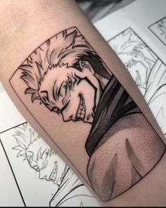 a man's arm with an anime character tattoo on the left side of his body