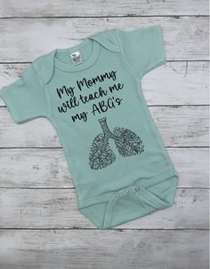 **Please note, we only have colored bodysuits in short sleeve sized 3-6 months at the moment. Please message us if you are interested in a different size and we can give you an estimate of when it will be available.  Please see our full etsy shop for additional bodysuit color options: www.etsy.com/shop/TheDodgyFoxBoutique Our designs are printed directly onto the garment for lasting wear, soft to touch images and lasting vibrance of color. These are not completed with iron on vinyl.   Available Gift For Doctor, Respiratory Therapist, Weather Day, Iron On Vinyl, Medical Professionals, Gender Neutral Baby, Phone Screen, Baby Gift, Baby Bodysuit