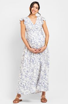 Delightful flowers lend warm-weather beauty to a lovely maxi dress made in a side-tie wrap style for easy adjustments throughout the trimesters. True wrap style with side tie closure; ties at back Surplice V-neck Short sleeves Lined 100% viscose Machine wash, line dry Imported Wrap Maternity Dress, White Floral Print Maternity Dress, Summer Blue Floral Print Maternity Dress, Fitted V-neck Maternity Dress With Floral Print, Fitted Maternity Dress With Floral Print And V-neck, Maternity V-neck Maxi Dress With Floral Print, Tie Wrap, Floral Wraps, Maternity Dress