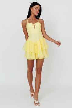 Lemon mini dress Lined Halterneck style Layered, ruffle hem Zipper in back Float through the weekend in our gorgeous Tuscan Summer mini dress. Featuring a padded bust and layered ruffle, flounce hem. It's perfect for a flirty sunset dinner with your crush. Team it with mules and a cute bag for a look that will make jaws drop. MODEL INFO Model is wearing size XS Height: 5'7" Bust: 32.0" Waist: 24.0" Hips: 36.0" CARE Hand Wash Cold. Do Not Iron. MATERIAL POLYESTER Tuscan Summer, Hoco Inspo, Rush Week, Sunset Dinner, Fancy Fits, School Dance Dresses, Snow Ball, Summer Mini Dress, Yellow Bridesmaids