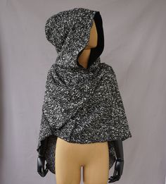 This cape/ shawl has a dilisious large hood. With a large scarf that gives you room to play. The hood is fully lined with the softest organic cotton. On the scarf are two ribbons that you can use to bind the scarf behind your neck. This creation has structured serger seams on the outside. You can go a lot of ways with this piece. Dress up for a costume party, go full outfitted with your larp costume or as a every day statement piece. Designed and handmade by Solmode in the Netherlands. * Materia Hooded Winter Cape For Cosplay, Winter Hooded Cape For Cosplay, Hooded Cape For Cosplay In Winter, Gothic Hooded Winter Cape, Hooded Winter Cape For Costumes, Hooded Winter Cape For Costume Events, Gothic Black Hooded Cape, Gothic Hooded Cape For Larp, Black Hooded Medieval Outerwear