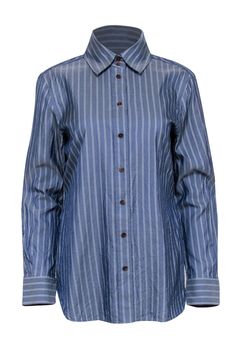 The classic feel of this striped Lafayette 148 button up is modernized with a loose fit. A cotton and silk blend feels good on the skin, making it an easy choice for weekend errands. Style this classic piece with denim or tailored pants for a casual Friday at work. Size L 73% Cotton, 27% Silk Loose fit Long length Long sleeves Brown buttons Bust 38" Waist 36" Shoulder to hem 28" Sleeve length 24" Casual Friday, Tailored Pants, Luxury Fabrics, Chambray, White Stripe, Button Up Shirts, Button Up, Shirts Tops, Loose Fitting