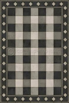 a black and white checkered rug with diamonds on the bottom, in an old fashion style