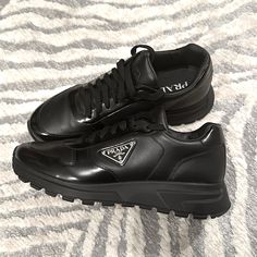 Men’s Prada “Prax Leather Sneakers” In Black Size 9. Literally Brand New. Perfect Condition. Designer Black Patent Leather Sneakers, Luxury Black Patent Leather Sneakers, Black Patent Leather Sneakers With Leather Sole, Designer Black Leather Sneakers, Black Sneakers With Leather Lining, Prada Shoes, Mens Shoes Sneakers, Leather Sneakers, Prada