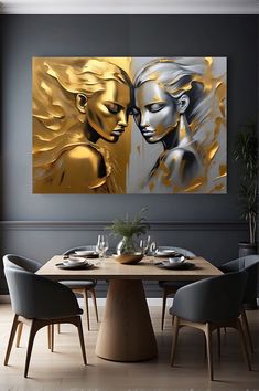 a dining room table with two paintings on the wall