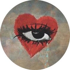 a red heart with an eye drawn on it