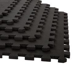 black rubber flooring tiles on white background with clippings for use in indoor play areas