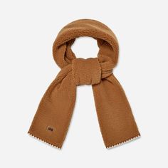 With a contrasting scallop trim, the UGG®fluff Scalloped Scarf puts a new twist on a classic winter accessory. | Plush fleece scarf. Self - 100% Polyester. Lining - Unlined. Features a scalloped trim on edge. 78 inch L X 7 inch W. Leather label with Graphic UGG® Font. Imported. | UGG® Women's UGG®fluff Scalloped Scarf Fleece Scarves in Chestnut Ugg Scarf, Fleece Scarves, Fleece Scarf, Scallop Trim, Scarf For Women, Leather Label, Scalloped Trim, Cold Weather Accessories, Winter Accessories