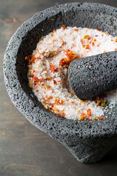 a mortar bowl filled with white and red stuff