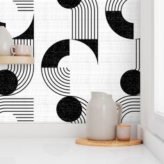 a wall with black and white designs on it